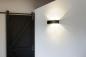 Preview: LOGS IN L Indoor LED Wandaufbauleuchte schwarz/messing 3000 K TRIAC dimmbar
